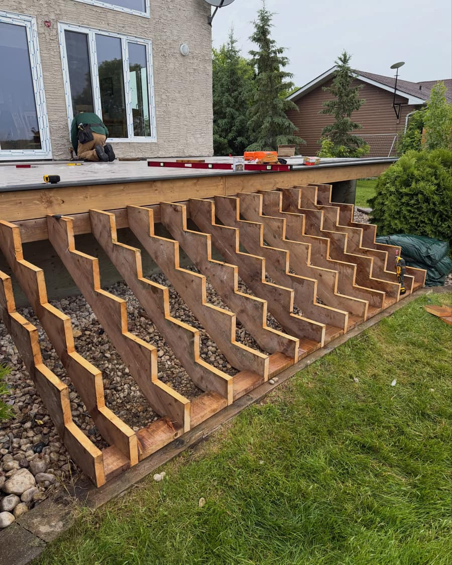 Freshly cut stair stringers laid out on site, ready for treads.